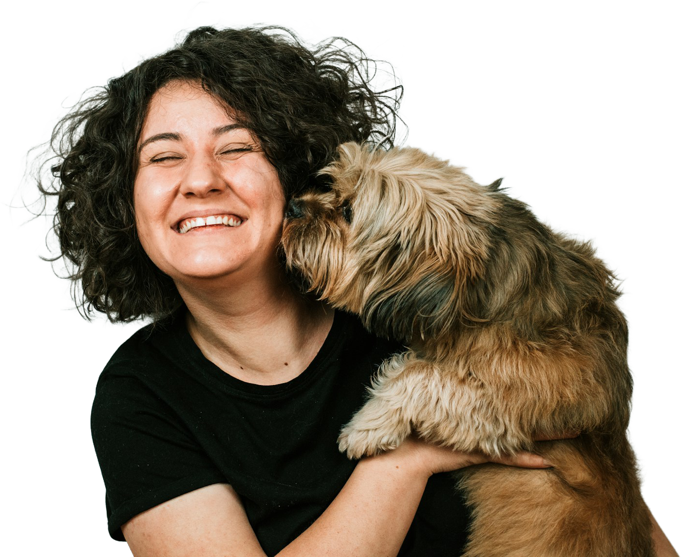 A happy dog being embraced at home
